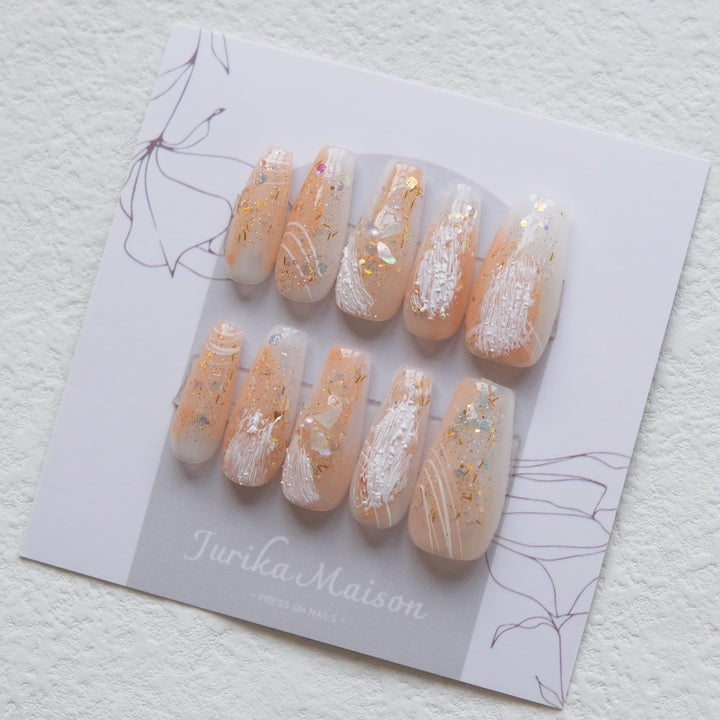 Jurika Maison luxury nude press on nails with shell fragment and glitter