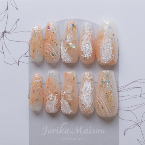 Jurika Maison luxury nude press on nails with shell fragment and glitter